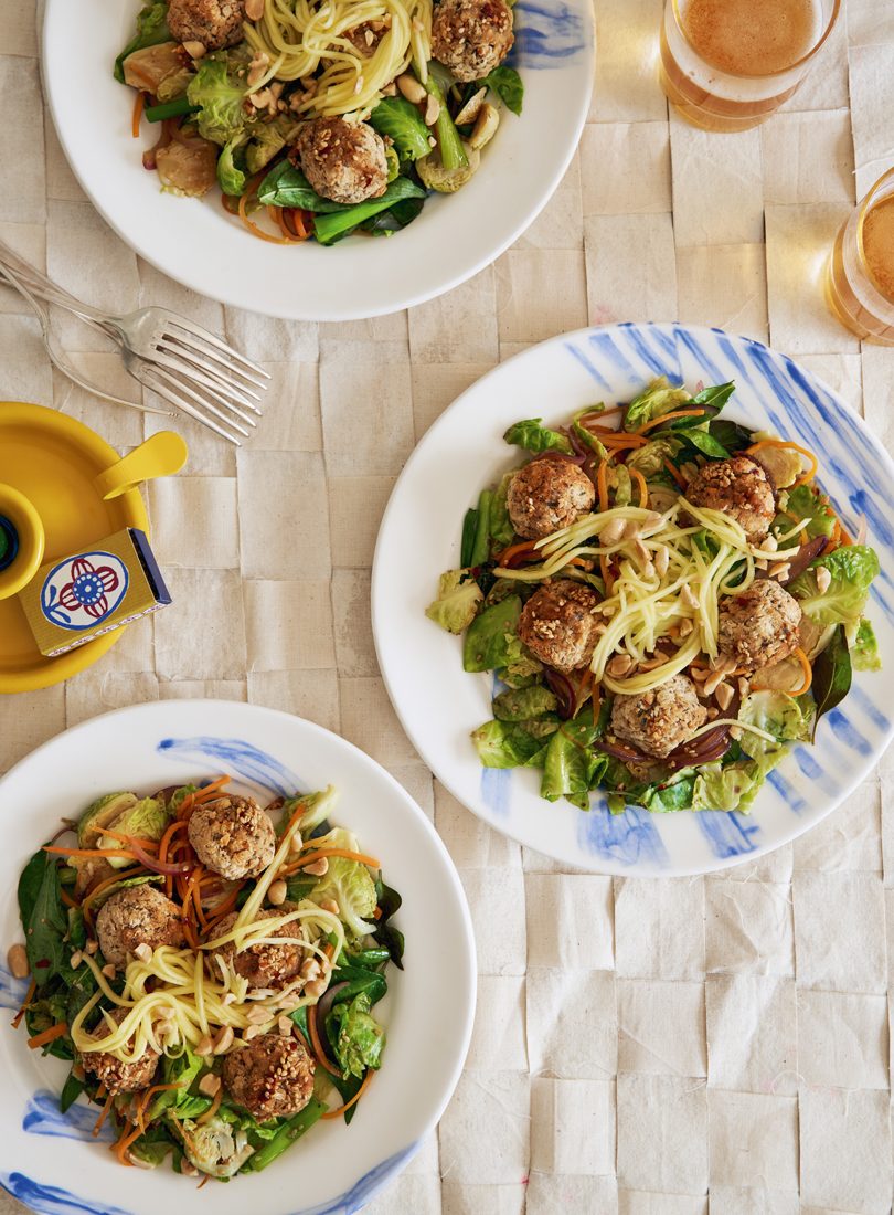 WHITE BEAN & LEMONGRASS DUMPLINGS, BRUSSELS SALAD WITH FRUIT PICKLE & PEANUTS